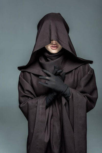 front view of woman in death costume gesturing isolated on grey