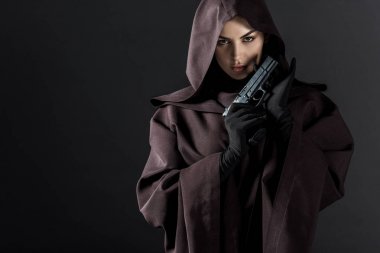 woman in death costume holding gun isolated on black clipart
