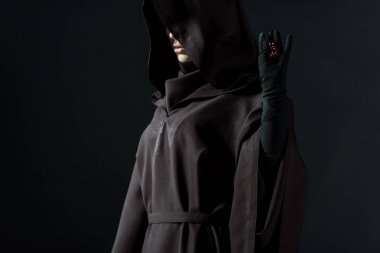 cropped view of woman in death costume holding dice isolated on black clipart