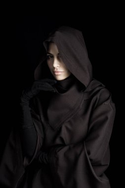 pensive woman in death costume looking at camera isolated on black clipart