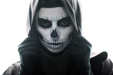 front view of woman with skull makeup looking at camera isolated on white