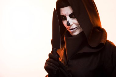 woman with skull makeup holding knife isolated on white clipart