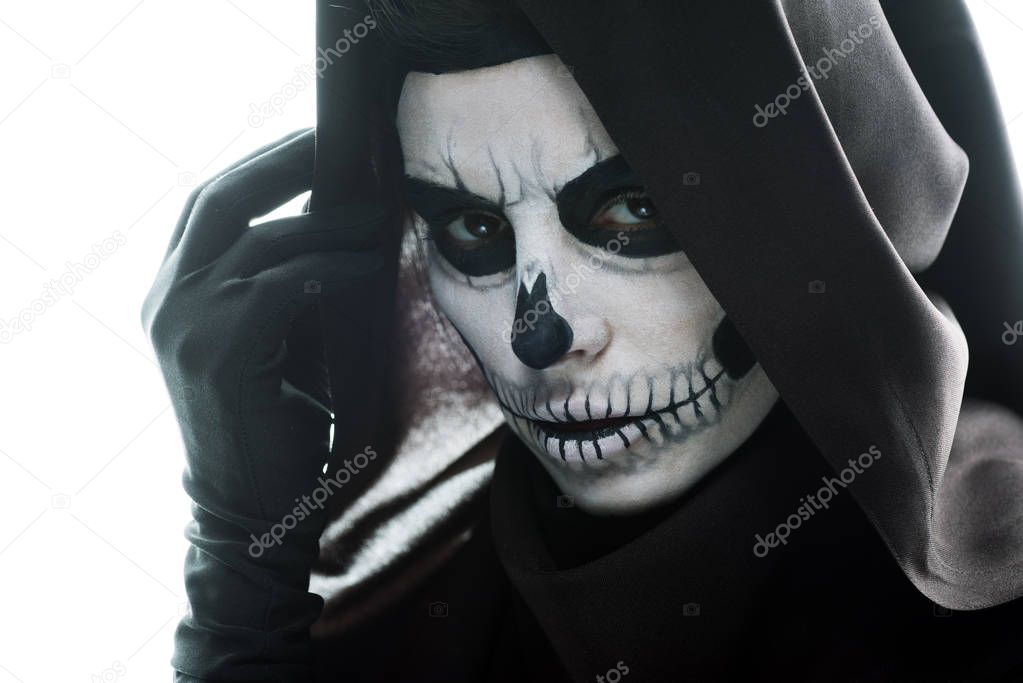 woman with skull makeup looking at camera isolated on white