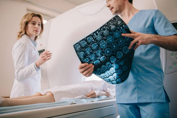 Selective Focus Doctor Holding Tomography Diagnosis While Radiologist Operating Scanner — Stock Photo, Image