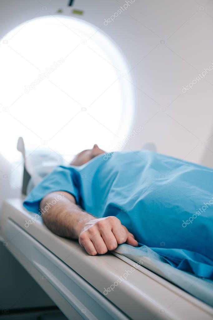 selective focus of patient having mri scanning test in hospital