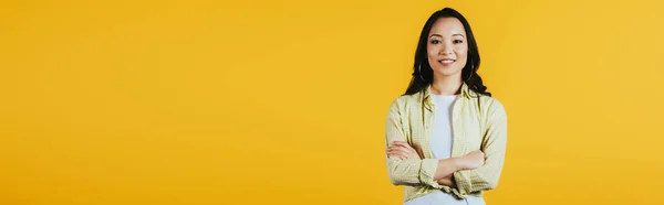 Smiling Brunette Asian Girl Crossed Arms Isolated Yellow — Stock Photo, Image