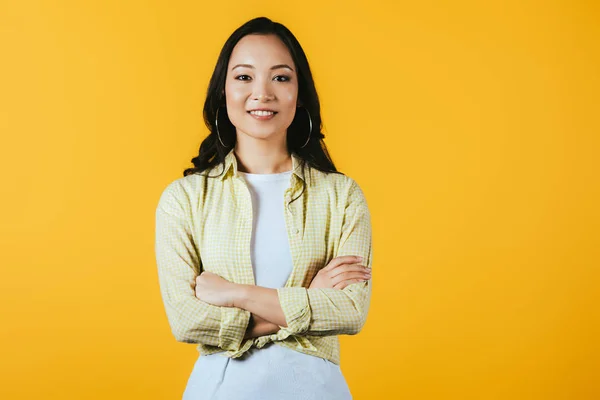 Smiling Asian Girl Crossed Arms Isolated Yellow — Stock Photo, Image