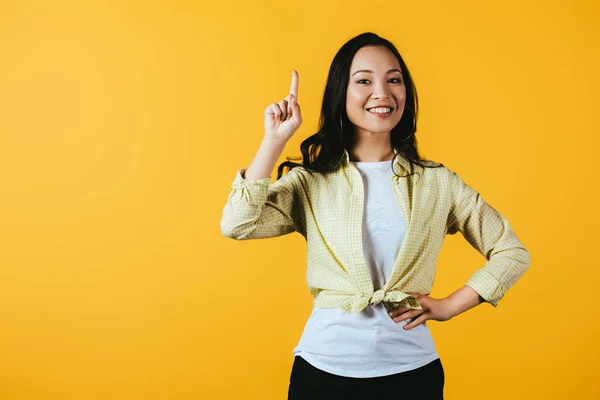 Attractive Happy Asian Girl Pointing Isolated Yellow — Stock Photo, Image