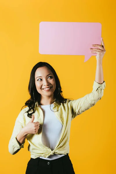 Casual Asian Woman Showing Thumb Holding Pink Speech Bubble Isolated — Stock Photo, Image