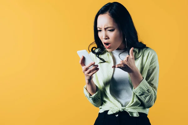 Angry Asian Young Woman Talking Smartphone Isolated Yellow — Stock Photo, Image