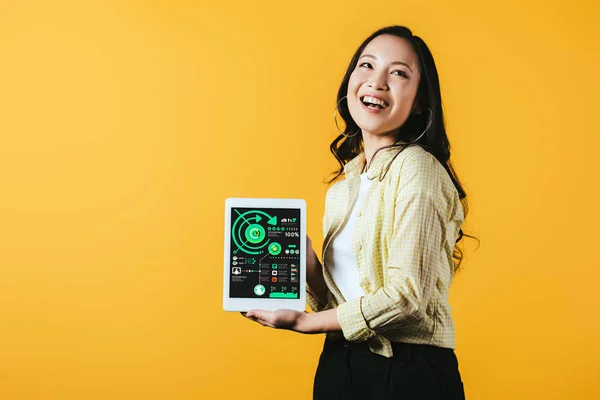 Smiling Asian Girl Showing Digital Tablet Infographic Isolated Yellow — Stock Photo, Image