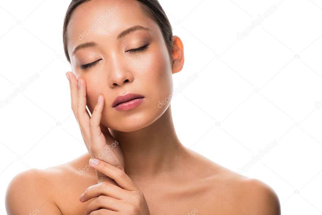 tender naked asian woman with closed eyes, isolated on white