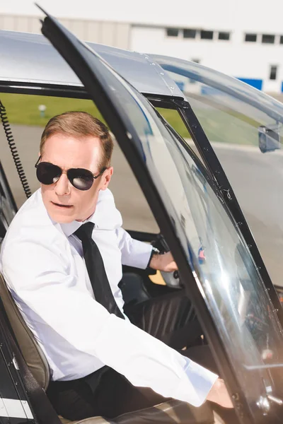 Handsome Pilot Sunglasses Formal Wear Sitting Helicopter Cabin Opening Door — Stock Photo, Image