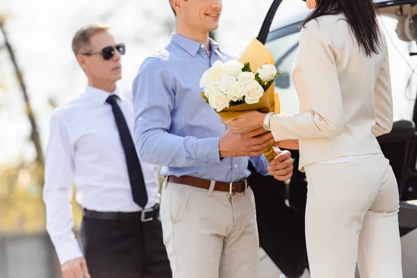 Cropped View Husband Giving Flowers Wife Romantic Date Helicopter Pilot — Stock Photo, Image