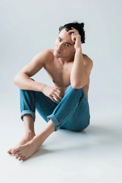 Handsome Muscular Man Looking Camera Sitting White — Stock Photo, Image