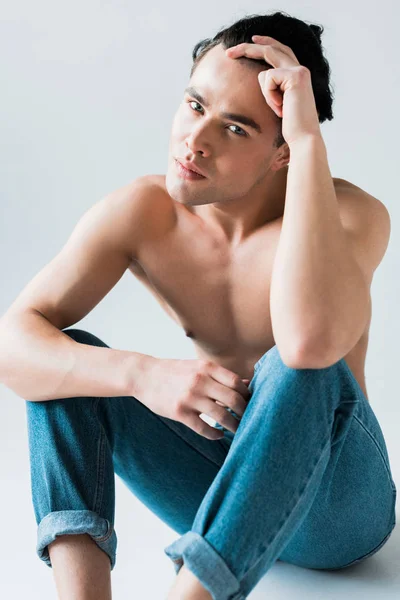 Muscular Shirtless Man Sitting Blue Jeans White — Stock Photo, Image