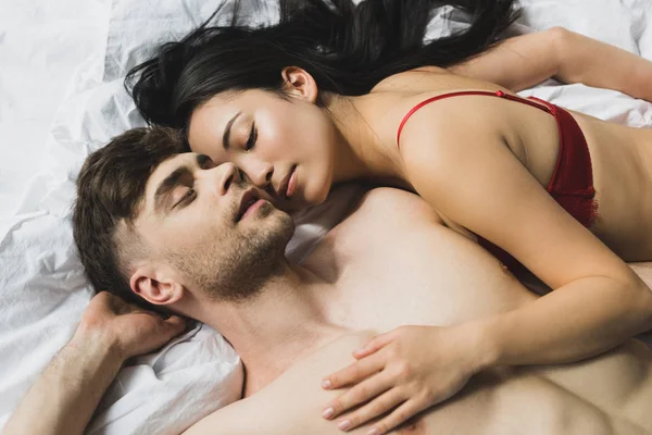 Top View Loving Interracial Couple Lying White Bedding Closed Eyes — Stok Foto