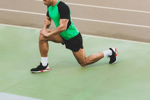 Cropped View Mixed Race Sportsman Stretching Stadium — Stock Photo, Image