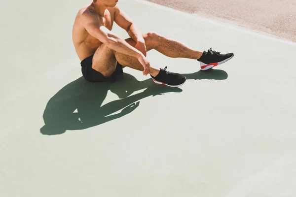 Cropped View Sportsman Black Sneakers Sitting Stadium — Stock Photo, Image