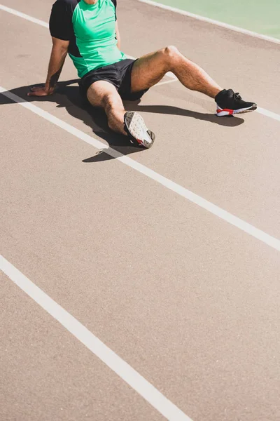 Cropped View Tired Sportsman Sitting Stadium — Stock Photo, Image