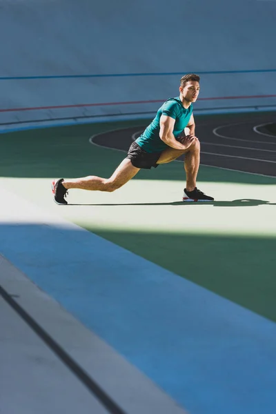 Mixed Race Sportsman Doing Lunges Stadium Standing Green Floor Sunlight — Stock Photo, Image