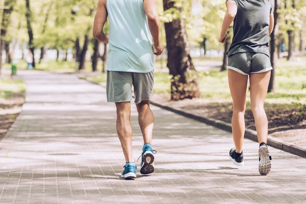 Cropped Shot Man Woman Jogging Together Walkway Park — Stock Photo, Image