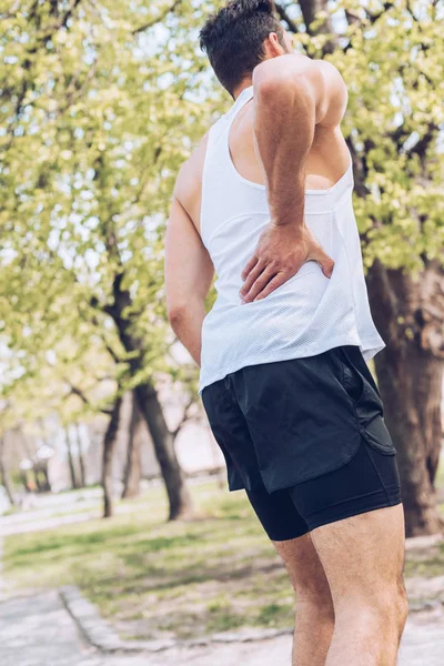 Young Sportsmen Suffering Pain While Touching Injured Back — Stock Photo, Image