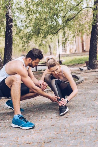 Young Sportsman Touching Injured Leg Pretty Sportswoman Suffering Pain — 스톡 사진