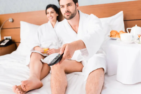 Selective Focus Man Holding Remote Controller Happy Brunette Woman — Stock Photo, Image