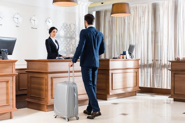 Attractive Receptionist Looking Businessman Luggage — Stock Photo, Image