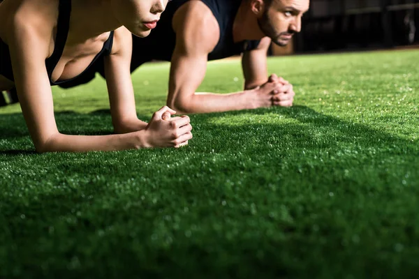 Cropped View Woman Doing Plank Exercise Handsome Man Grass — Stock Photo, Image