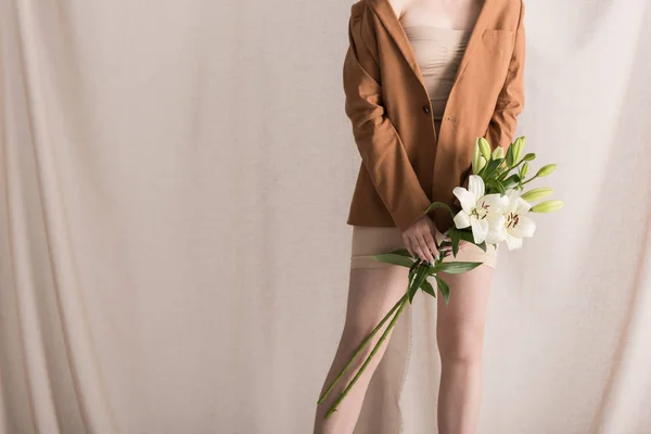 Cropped View Woman Holding Flowers Hands Standing Curtain Background — Stock Photo, Image