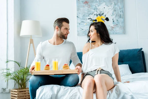 Boyfriend Holding Wooden Tray Tasty Pancakes Orange Juice While Looking — Stock Photo, Image