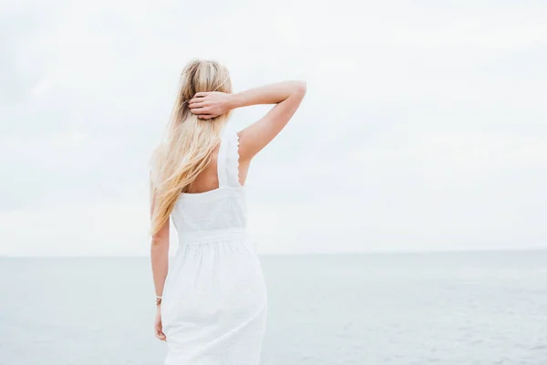 Back View Young Woman Standing Sea Touching Hair — Stock Photo, Image