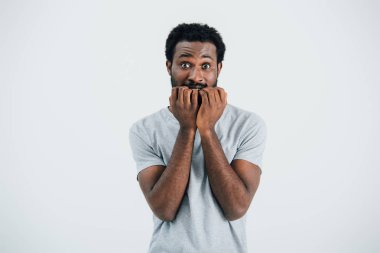 worried african american man in grey t-shirt, isolated on grey