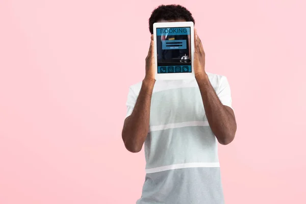 African American Man Showing Digital Tablet Booking App Isolated Pink — Stok Foto