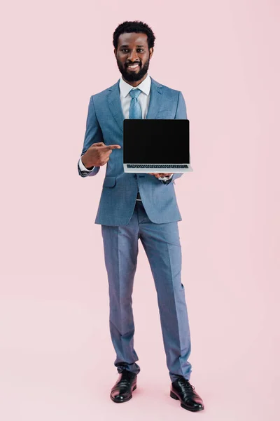 Smiling African American Businessman Pointing Laptop Blank Screen Isolated Pink — Stock Photo, Image