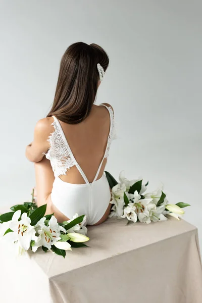 Back View Tender Young Woman White Lacy Bodysuit Sitting Lilies — Stock Photo, Image