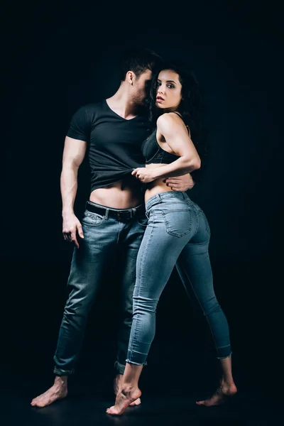 Sexy Barefoot Couple Denim Undressing While Standing Closely Isolated Black — Stock Photo, Image