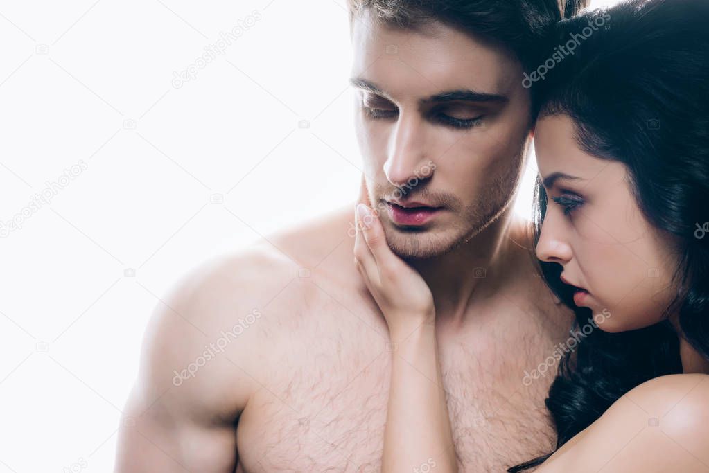 young woman touching naked boyfriend isolated on white