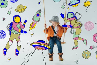 cute kid in jeans and orange shirt sitting on swing and looking at fairy space with astronauts illustration on grey background clipart
