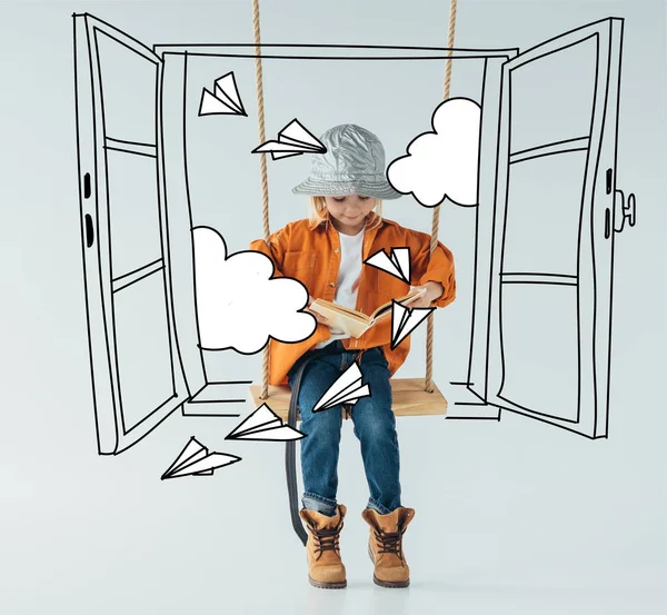 Cute Kid Jeans Orange Shirt Sitting Swing Reading Book Grey — Stock Photo, Image