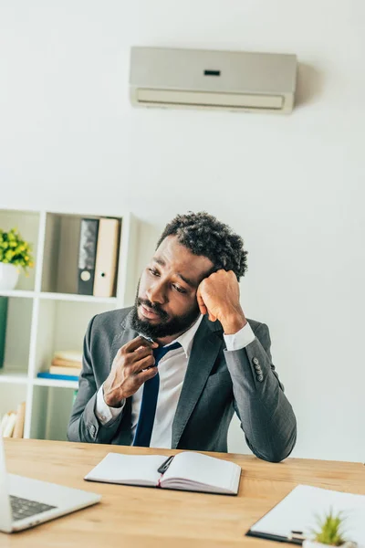 Exhausted African American Businessman Sitting Workplace Air Conditioner Suffering Heat — Stock Photo, Image