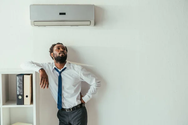 Young African American Businessman Standing Air Conditioner Holding Hand Hip — Stock Photo, Image