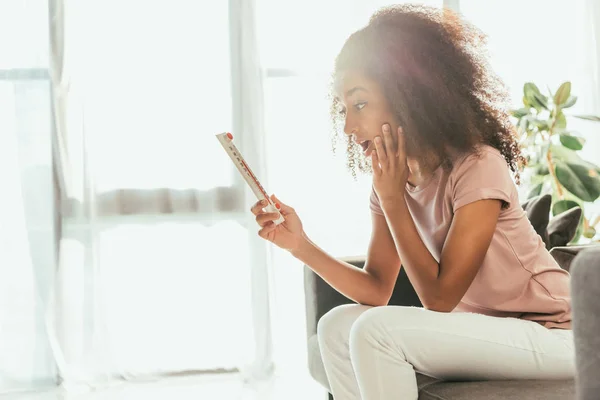 Shocked African American Woman Looking Thermometer While Suffering Summer Heat — Stock Photo, Image