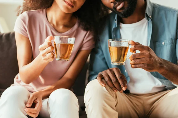 Cropped View African American Man Woman Holding Cups Tea While — Stock Photo, Image