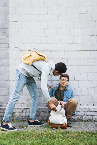 Aggressive African American Boy Taking Backpack Frightened Boy Glasses — Stock Photo, Image