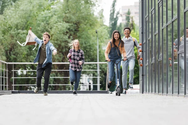 Happy Cheerful Friends Smiling Running Riding Scooter — Stock Photo, Image