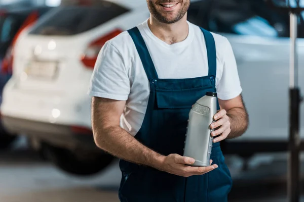 Cropped View Cheerful Car Mechanic Holding Bottle Car Oil — Stock Photo, Image