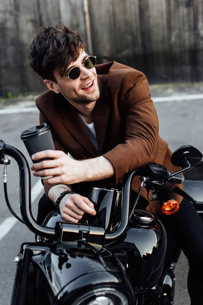 Young Man Sitting Motorcycle Smiling Looking Away Holding Paper Cup — Stock Photo, Image